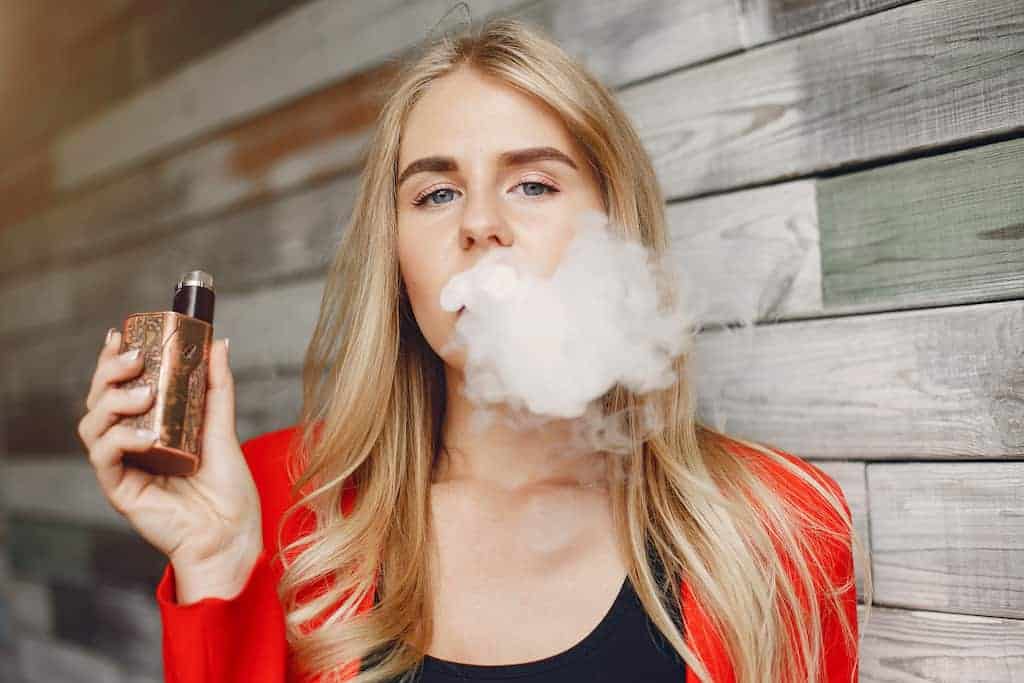 A young woman vaping