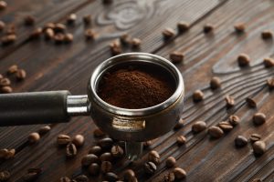 Grounded coffee beans in a portafilter